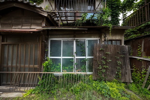 Front view abandoned house with rotted wood