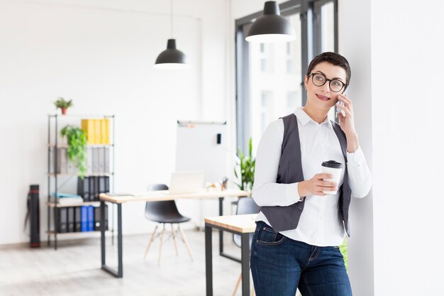 Front view adult woman talking on phone