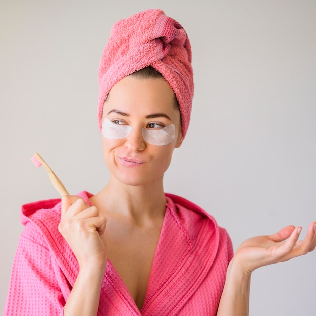 Free Photo front view of alluring woman with eye patches