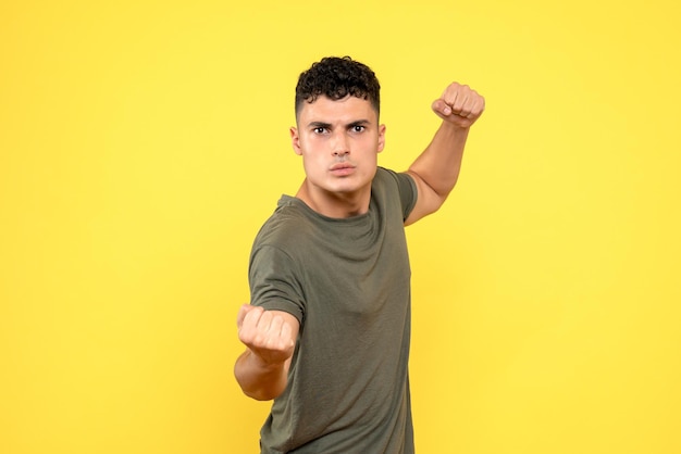 Front view of angry guy is standing in a fighting position