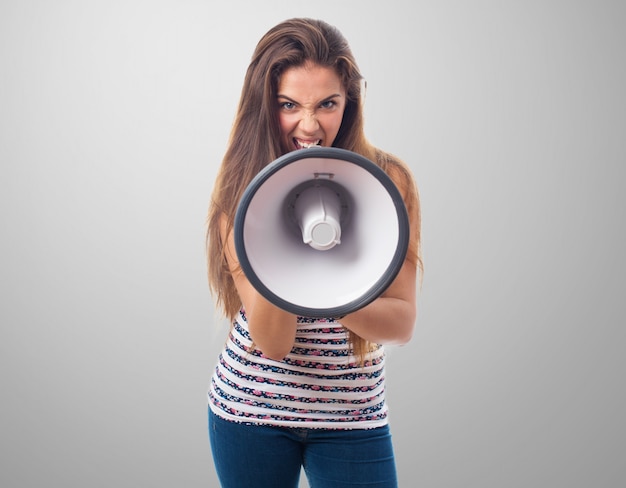 Free photo front view of angry teenager with a megaphone