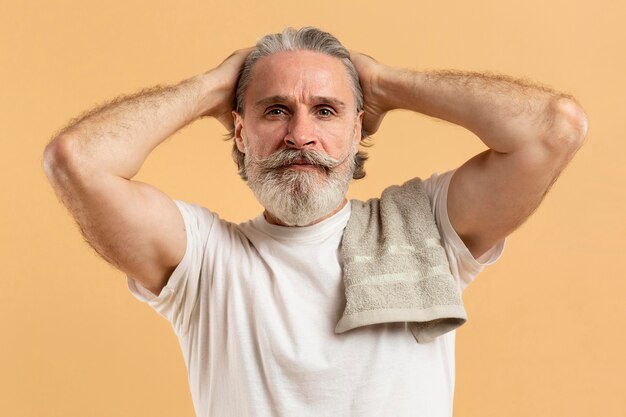 Front view of attractive bearded elder man