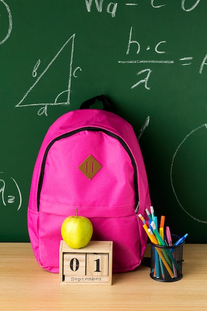 Free Photo front view of back to school backpack with apple and pencils