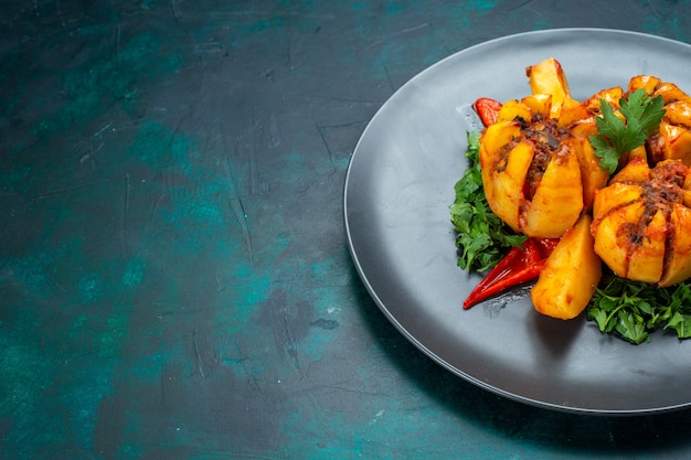 Free Photo front view baked potatoes with minced meat and greens inside plate on the dark blue desk.