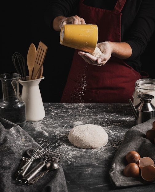 Front view baker mixing dough composition