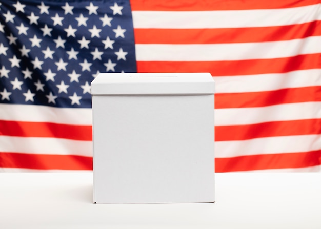 Free photo front view ballot box with american flag on background