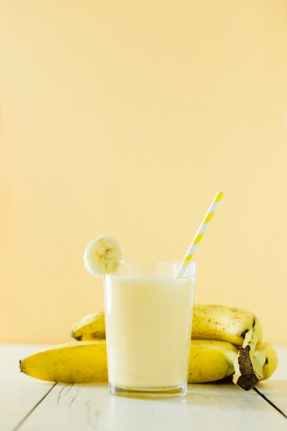 Front view of banana milkshake with fruits