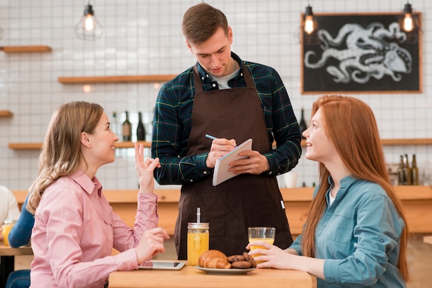 Front view of barista taking an order