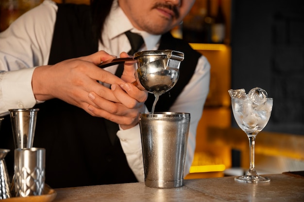 Free Photo front view bartender preparing drink