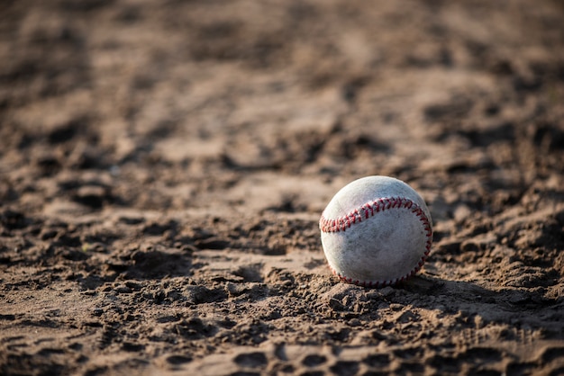 Free photo front view of baseball in dirt