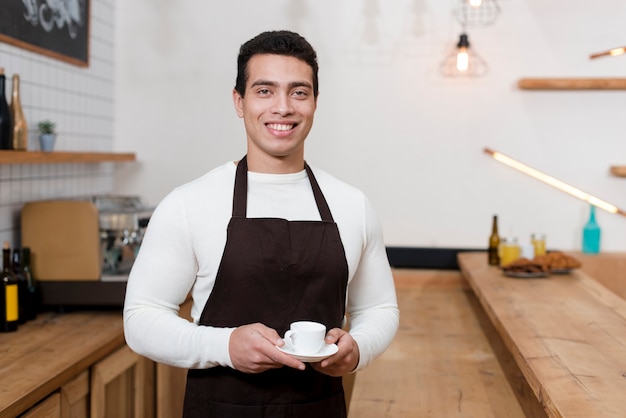 Front view of batista in cafe