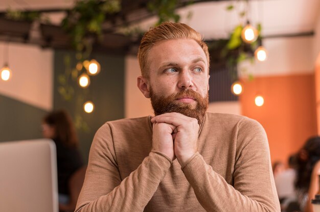 Front view bearded man looking away