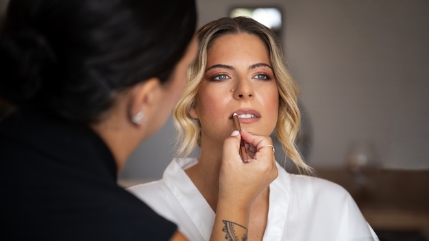 Free Photo front view beautiful bride getting ready