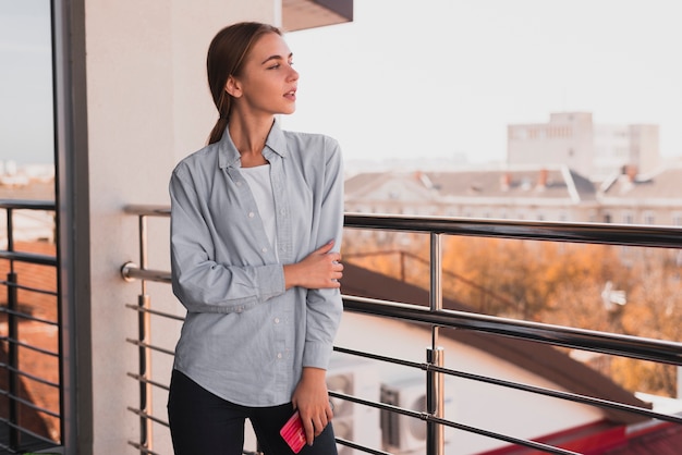 Free photo front view beautiful female on balcony