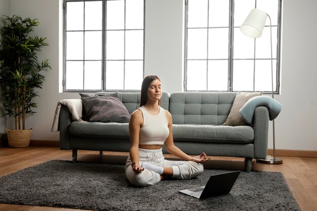 Front view of beautiful woman doing indoor activity