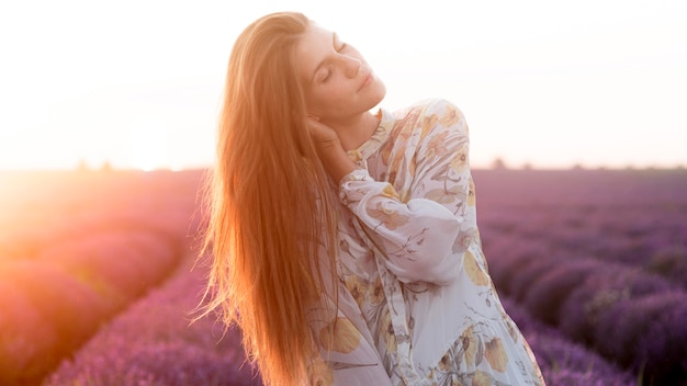 Free Photo front view of beautiful woman in nature