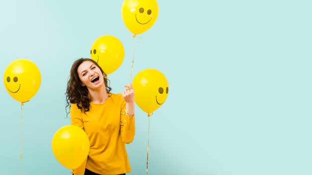 Free photo front view of beautiful woman with balloons