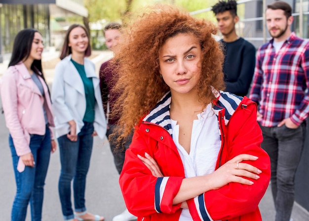 Front view of beautiful woman with curly hairs looking at camera