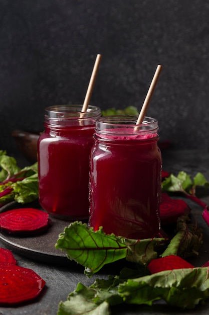 Free Photo front view beet juice in jars