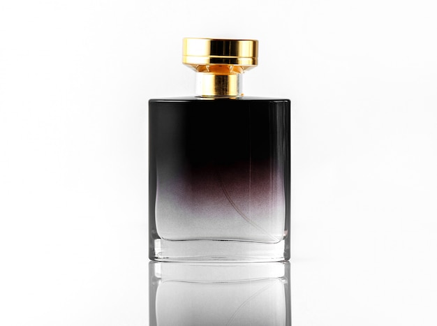 A front view black fragrance with golden cap on the white isolated desk