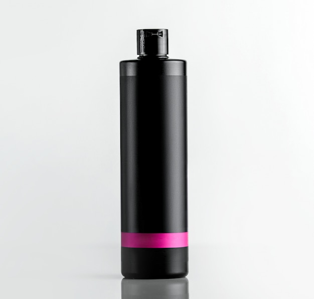 Free Photo front view black plastic bottle from under shampoo with a pink strip