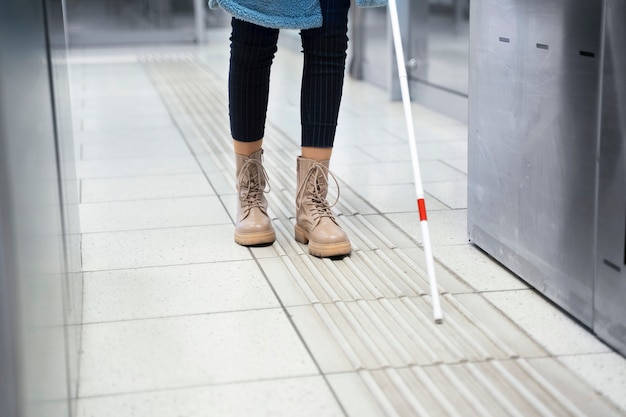 Front view blind person with white cane