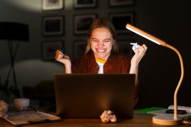 Free photo front view of blonde woman at laptop