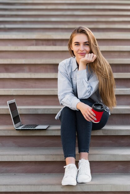 Front view blonde woman looking at photographer