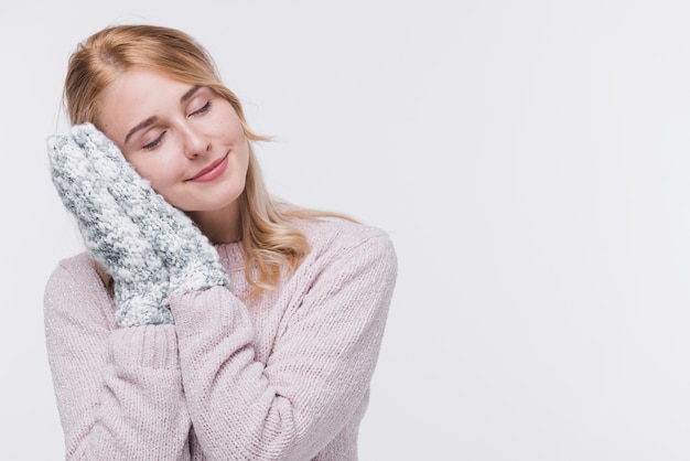 Front view blonde woman with winter gloves