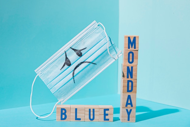 Front view of blue monday concept with cubes