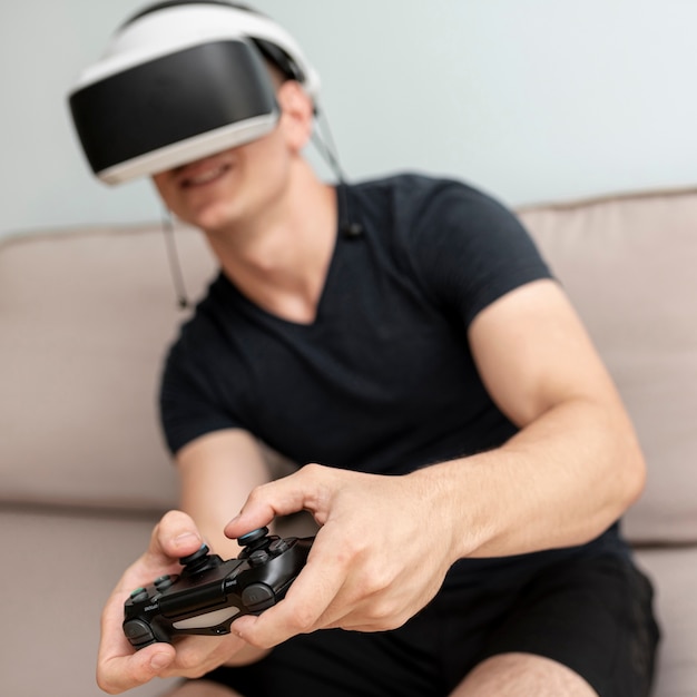 Free photo front view blurred teenager with controller