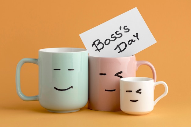 Free photo front view of boss day concept with cups