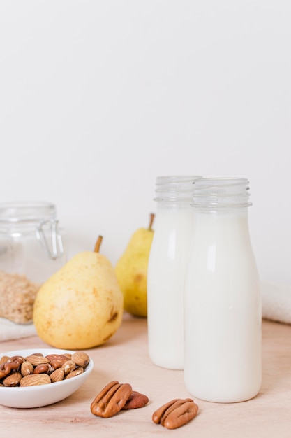 Front view bottles of milk on the table