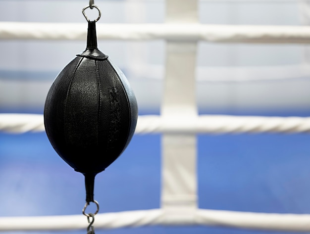 Free Photo front view of boxing equipment next to ring