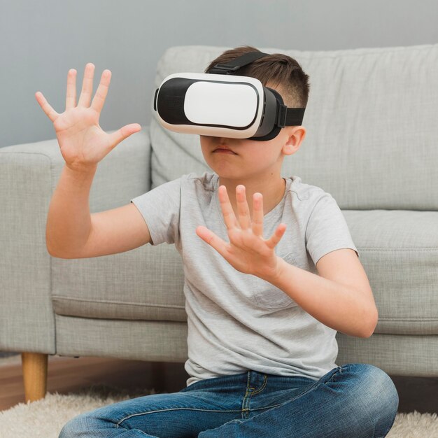 Front view of boy experiencing virtual reality