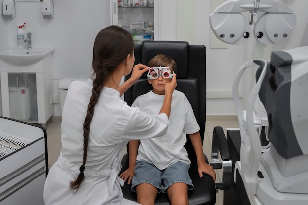 Front view boy at eye's checkup