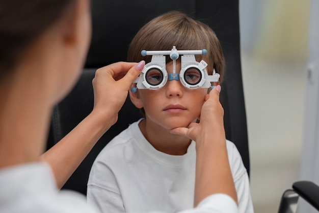 Front view boy at eye's checkup