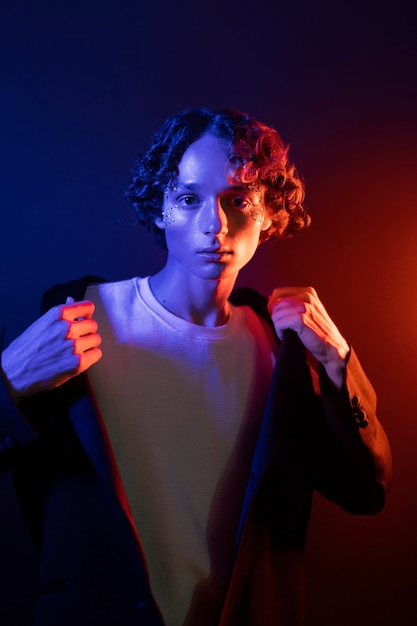 Free photo front view boy posing in studio