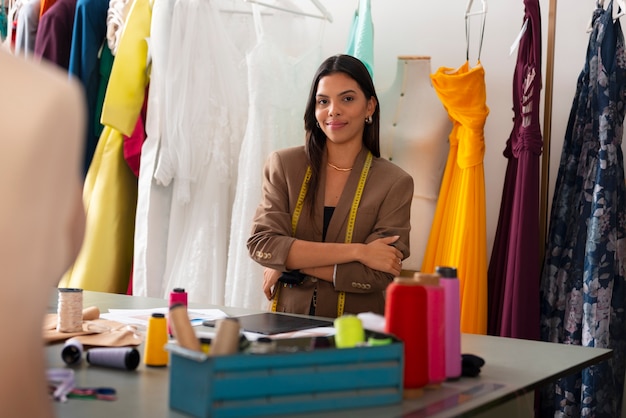 Free photo front view brazilian woman working as clothing designer