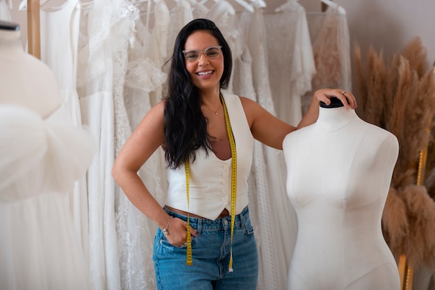 Front view brazilian woman working as clothing designer