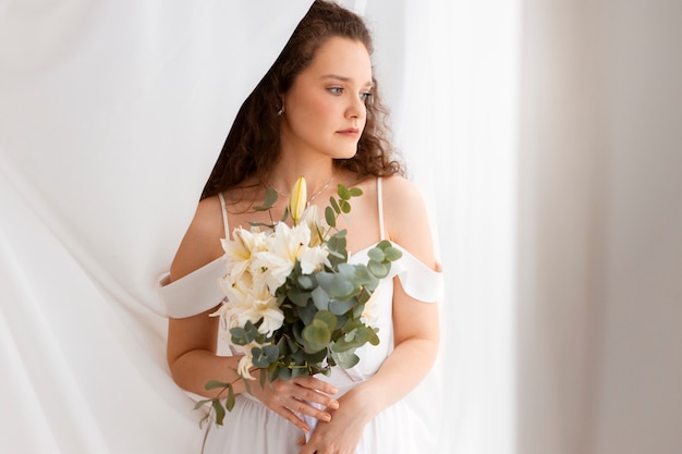 Free photo front view bride posing indoors