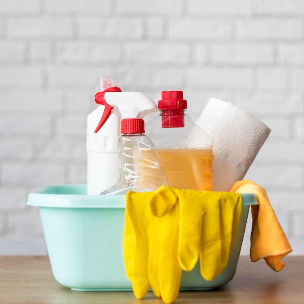 Free Photo front view of bucket with cleaning solutions and gloves