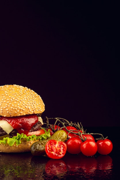 Free photo front view burger with black background