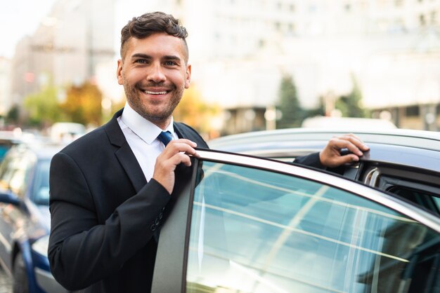 Front view business man and car