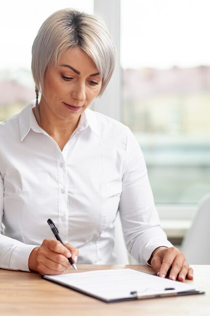 Front view business woman making plans