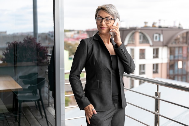 Free Photo front view business woman talking over phone