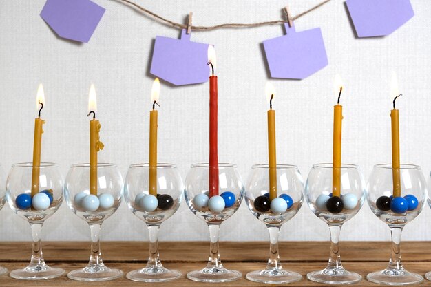 Free Photo front view candles and copy space garlands