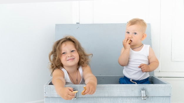 Free Photo front view children sitting in a box