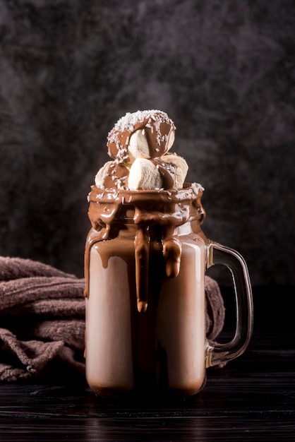 Front view chocolate dessert in jar with marshmallows