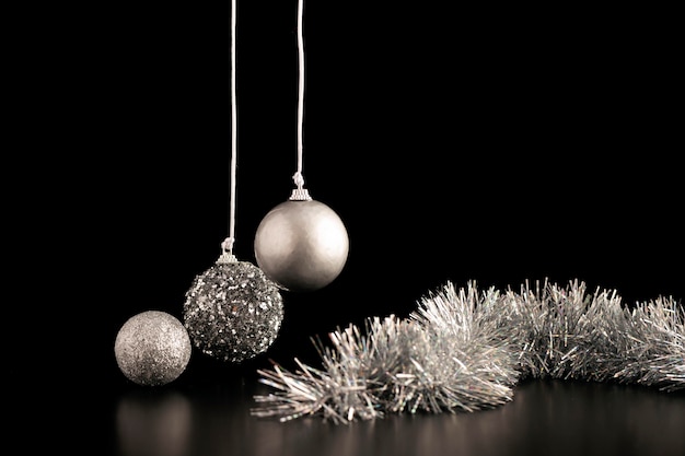 Front view of christmas ornaments with tinsel